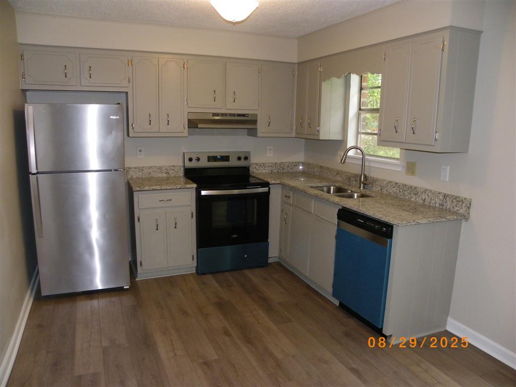 3640 Elliott Boulevard Augusta, GA 30906 - Photo 7 of 21 Kitchen- Refinished cabinets, New Granite Counter tops-deep sink-faucet, New Dishwasher, New smooth surface range, New vent hood. Clean Stainless steel finish Refrigerator