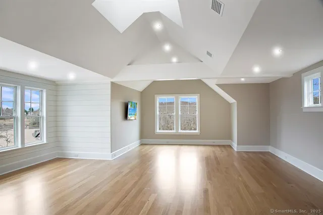 a kitchen with lots of counter top space and painting on the wall