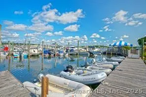 a view of a swimming pool with outdoor seating
