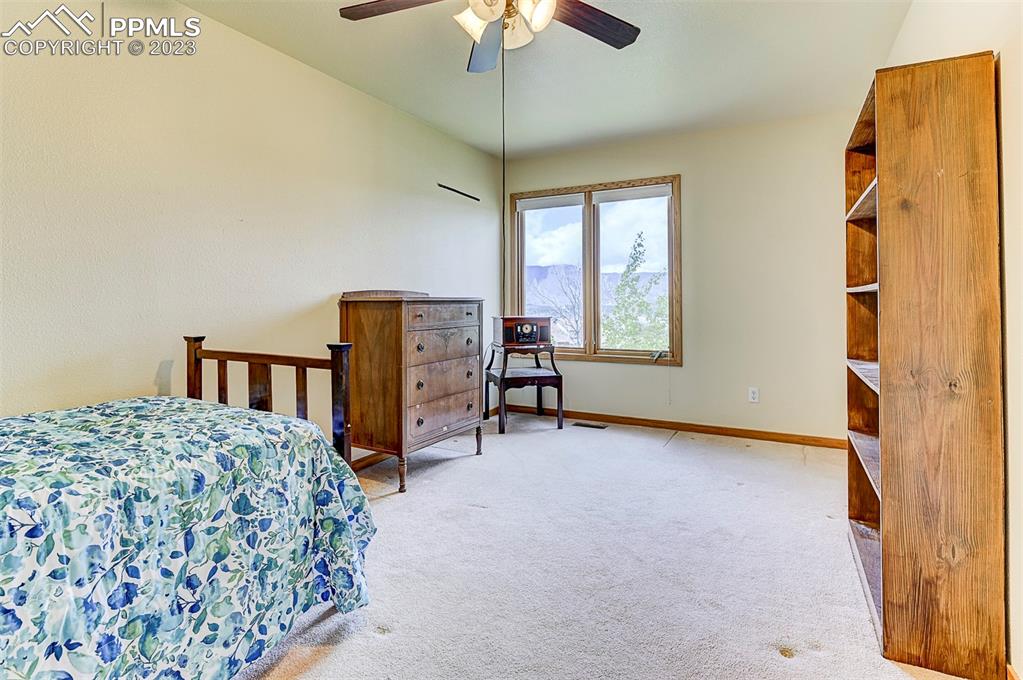 750 Bowstring Road Monument, CO 80132 - Photo 26 of 34 a bedroom with bed and window