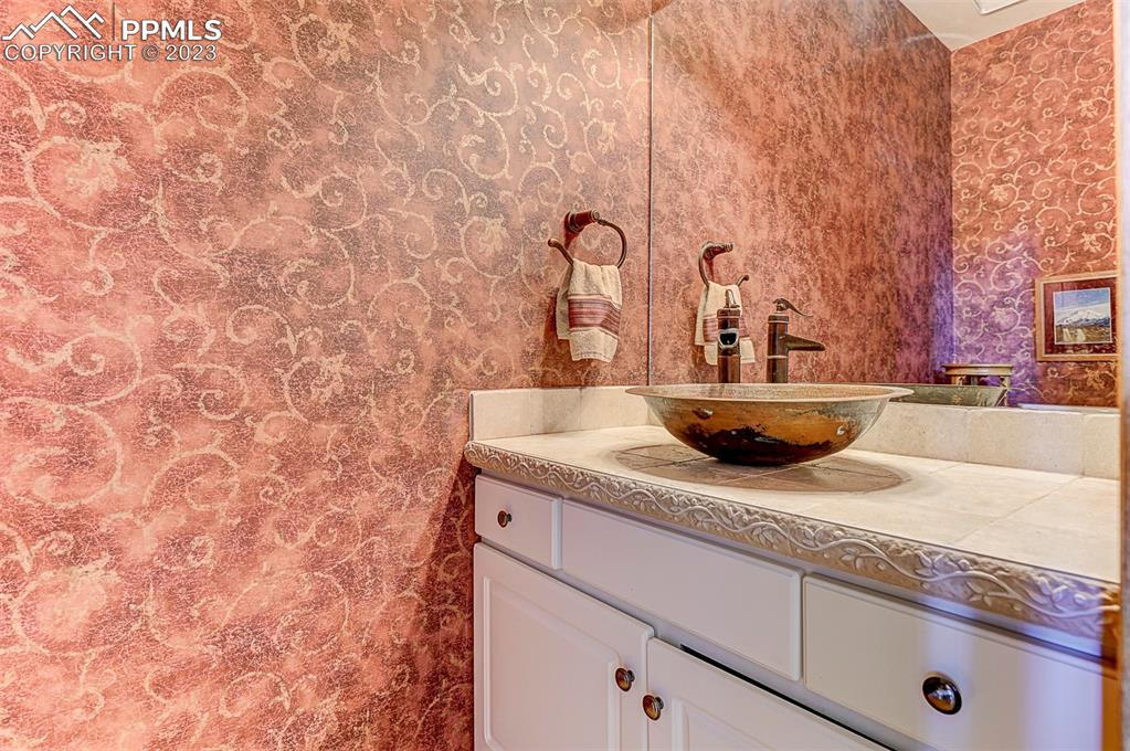 750 Bowstring Road Monument, CO 80132 - Photo 29 of 34 a bathroom with a sink and vanity