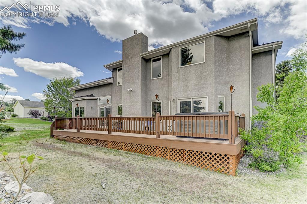 750 Bowstring Road Monument, CO 80132 - Photo 33 of 34 a view of a house with a yard