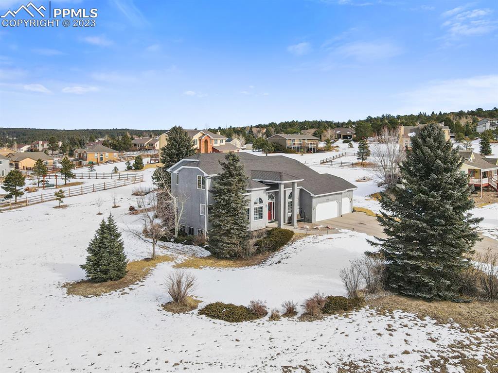 750 Bowstring Road Monument, CO 80132 - Photo 34 of 34 a view of a house with a snow in the background