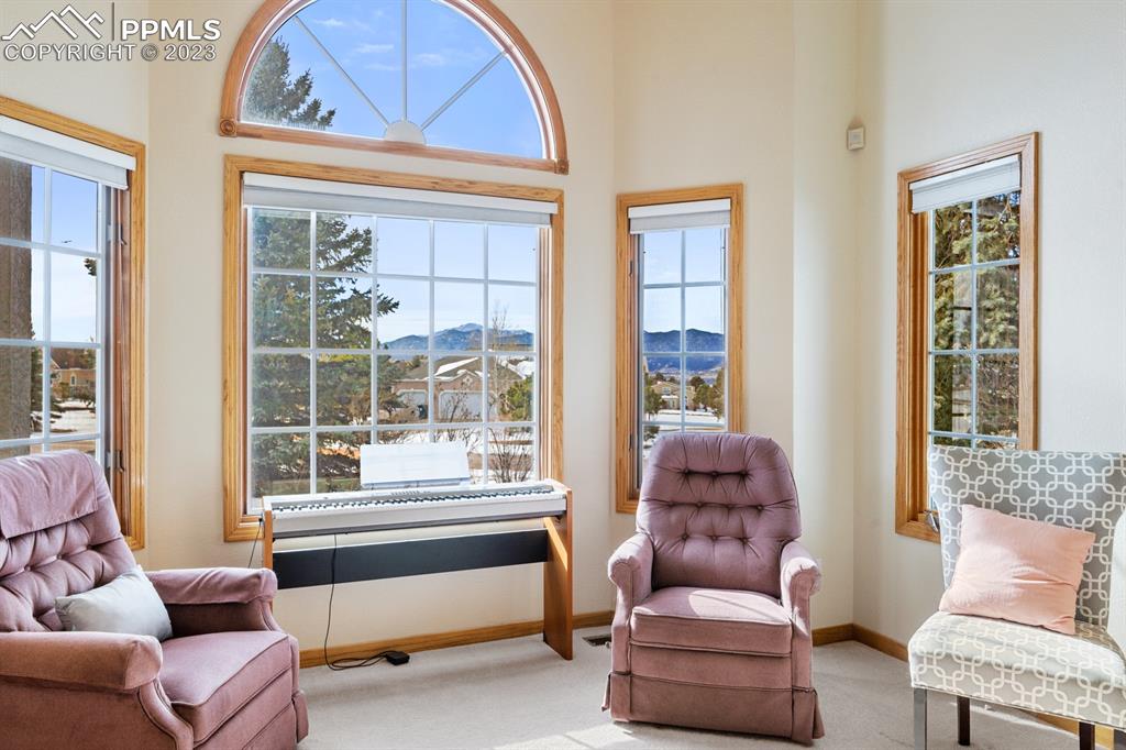 750 Bowstring Road Monument, CO 80132 - Photo 5 of 34 a living room with furniture and a large window