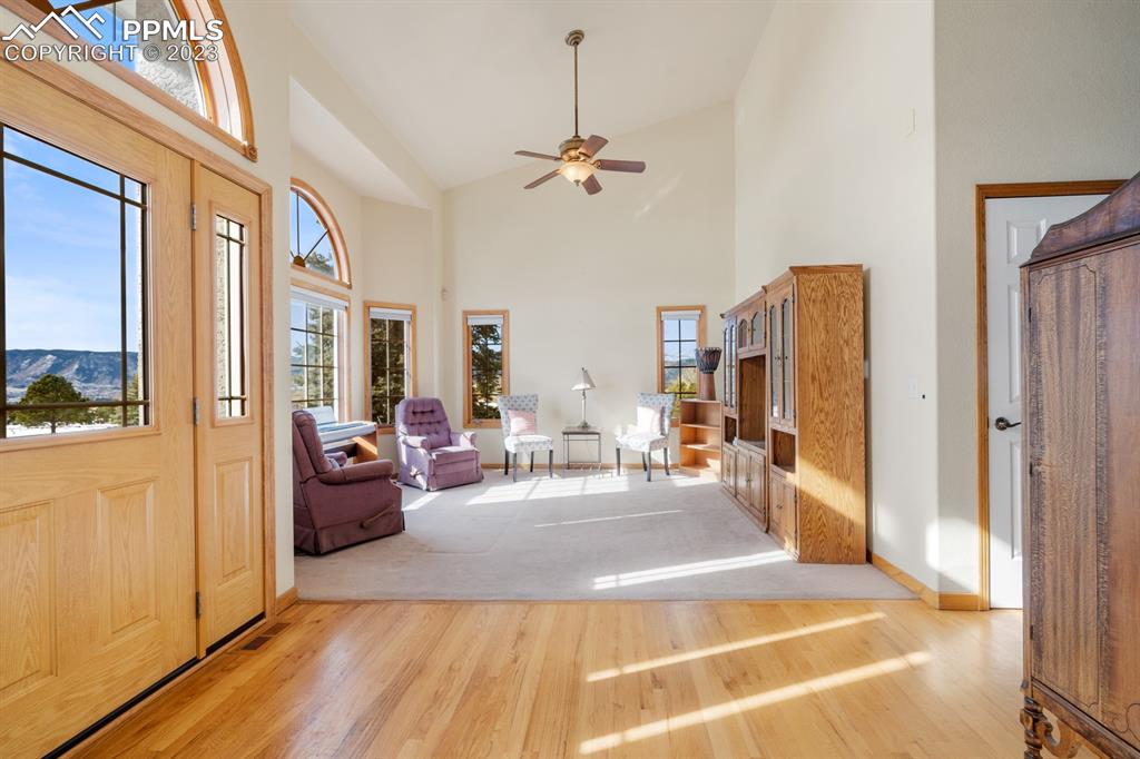 750 Bowstring Road Monument, CO 80132 - Photo 6 of 34 a view of a livingroom with furniture and windows