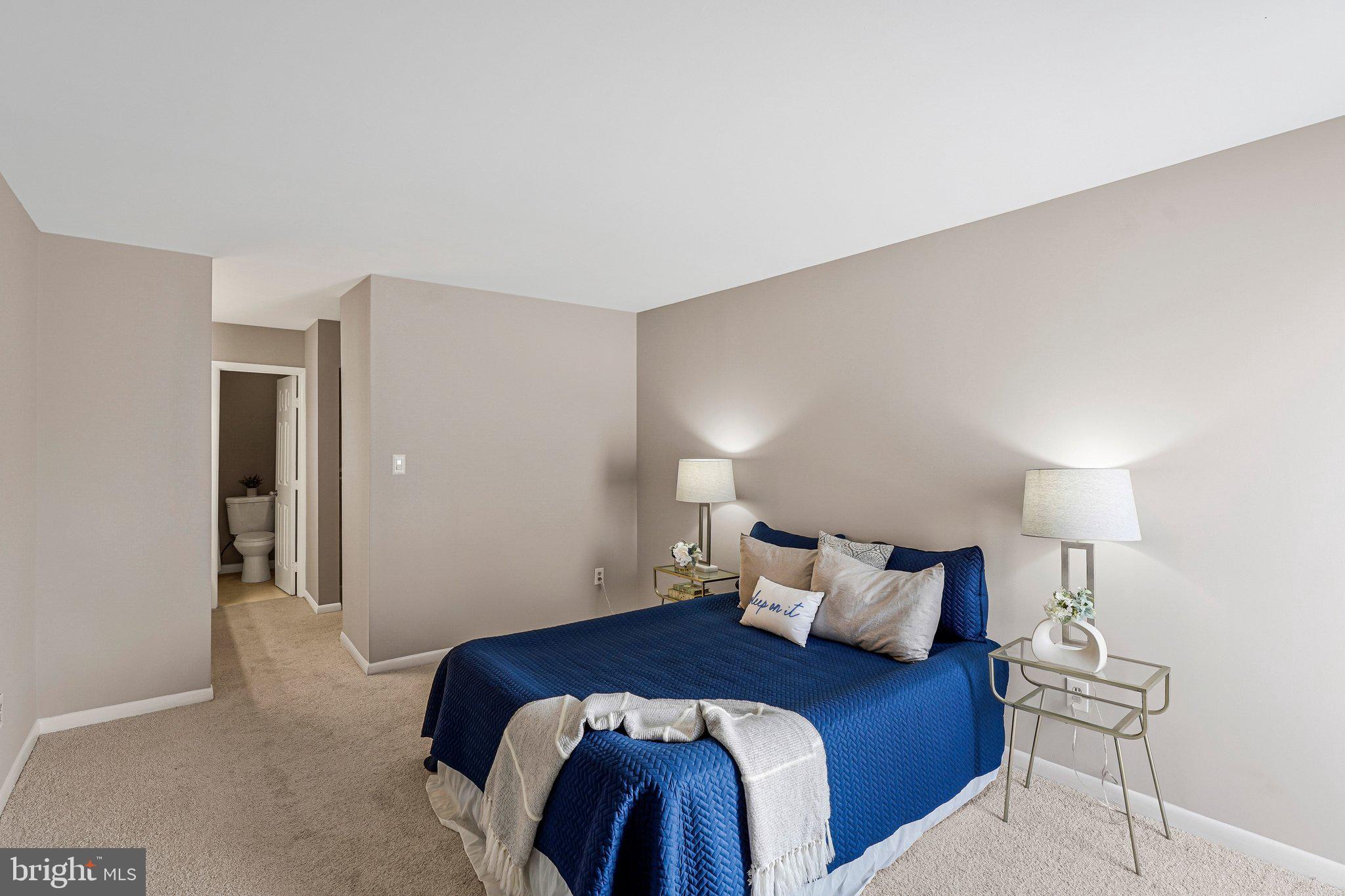 5778 B Rexford Court, Unit 5778B Springfield, VA 22152 - Photo 10 of 24 a bedroom with a bed and a lamp
