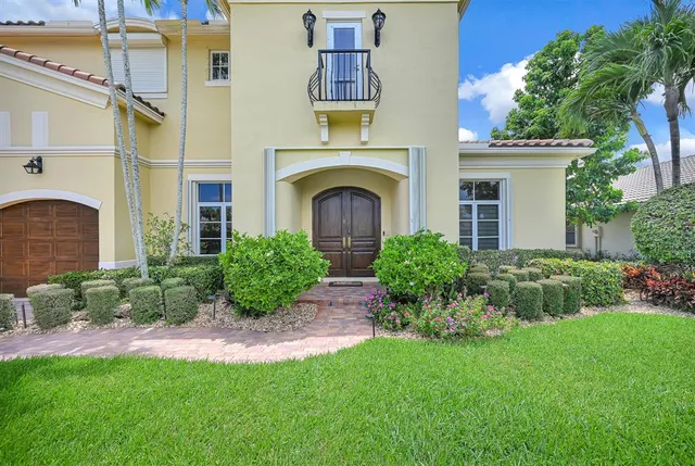 a living room with furniture and wooden floors
