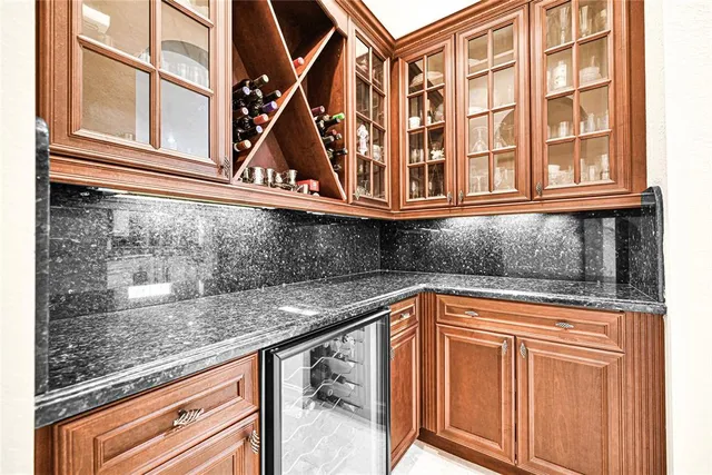 a bathroom with a sink a toilet a mirror and shower