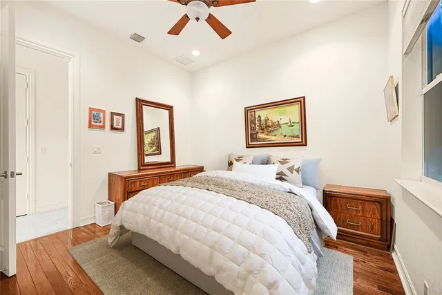 a view of a room with wooden floor kitchen view and dining room