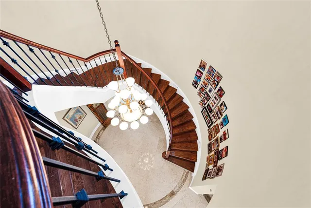 a white toilet sitting next to a bath tub and a shower