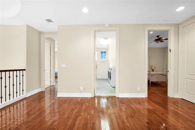 a bedroom with a bed couch and a window