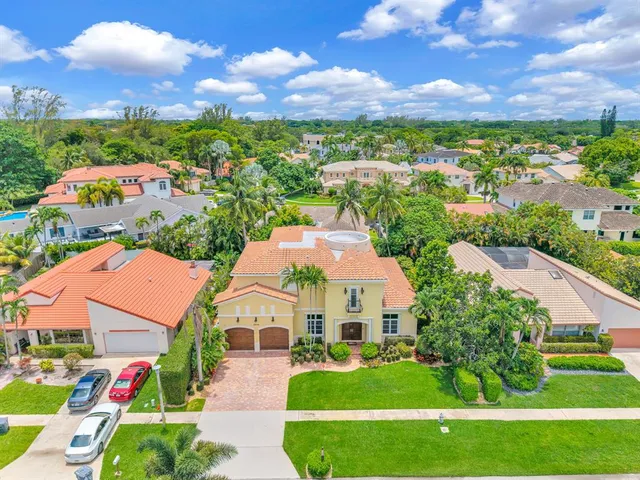 a living room with furniture a dining table and chairs with wooden floor