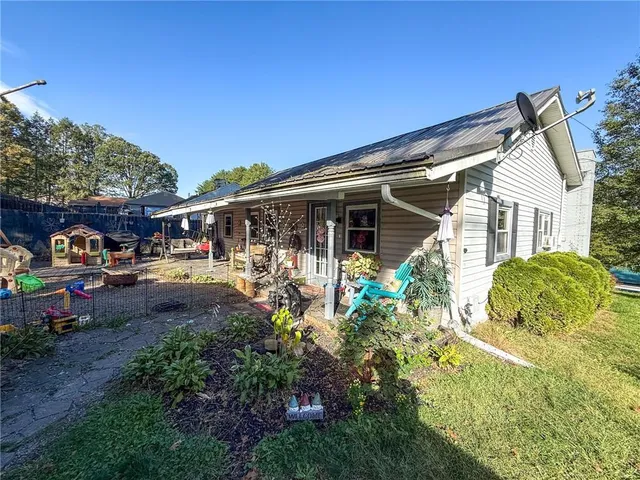 a view of a backyard with a car parked