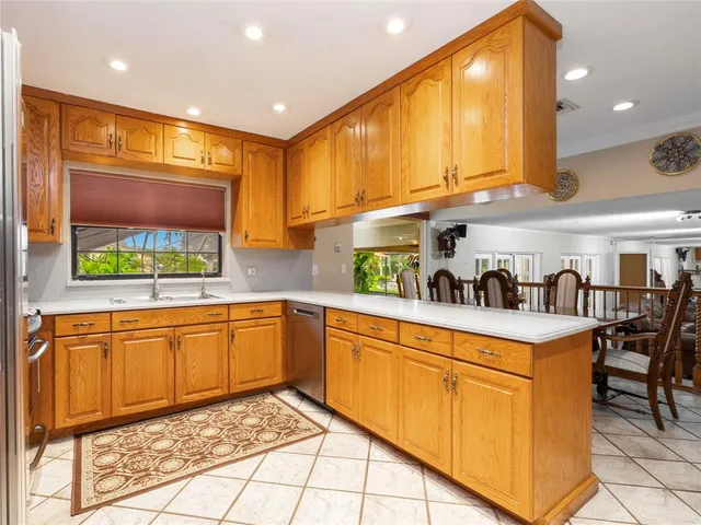 a kitchen with stainless steel appliances granite countertop a sink and cabinets