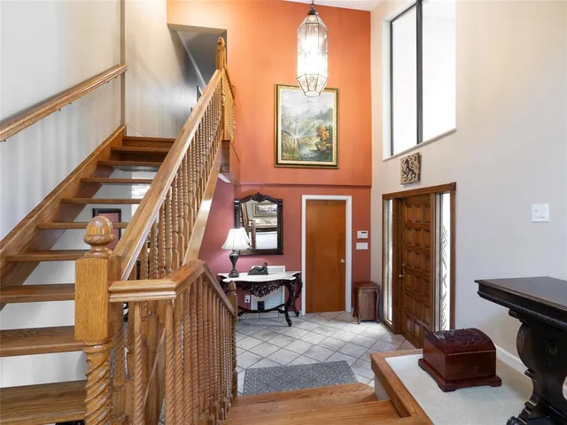 a view of a livingroom with furniture and stairs