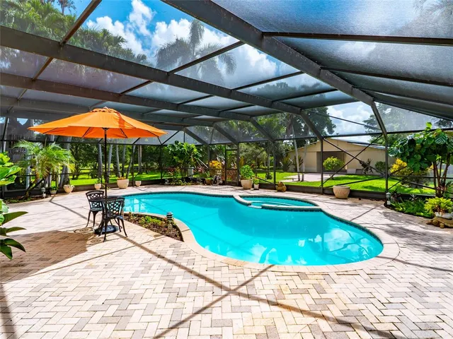 a view of swimming pool with lounge chair