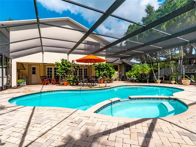 a view of a swimming pool with a patio