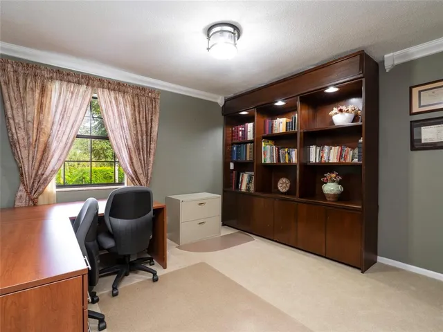 a view of workspace with furniture and window