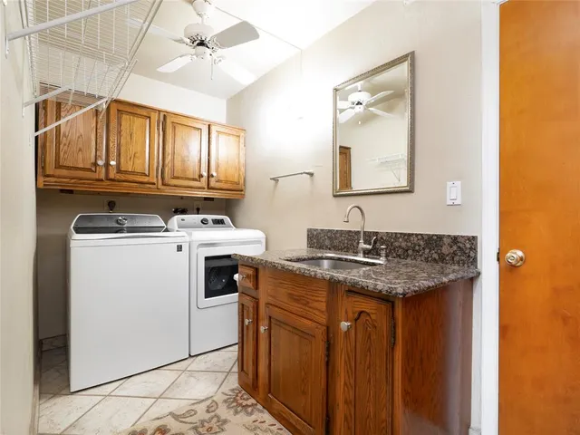 a utility room with cabinets
