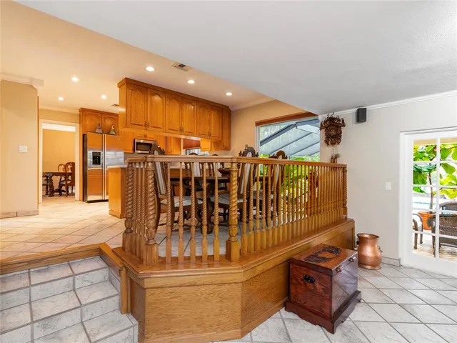 a view of kitchen with furniture and floor to ceiling window