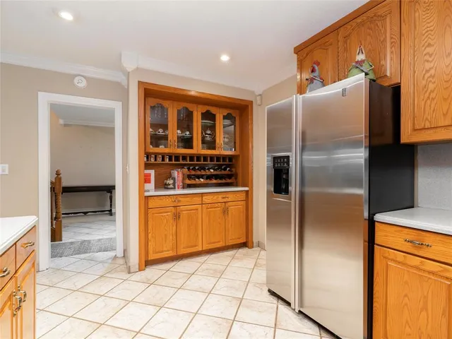 a kitchen with stainless steel appliances granite countertop a refrigerator and a sink