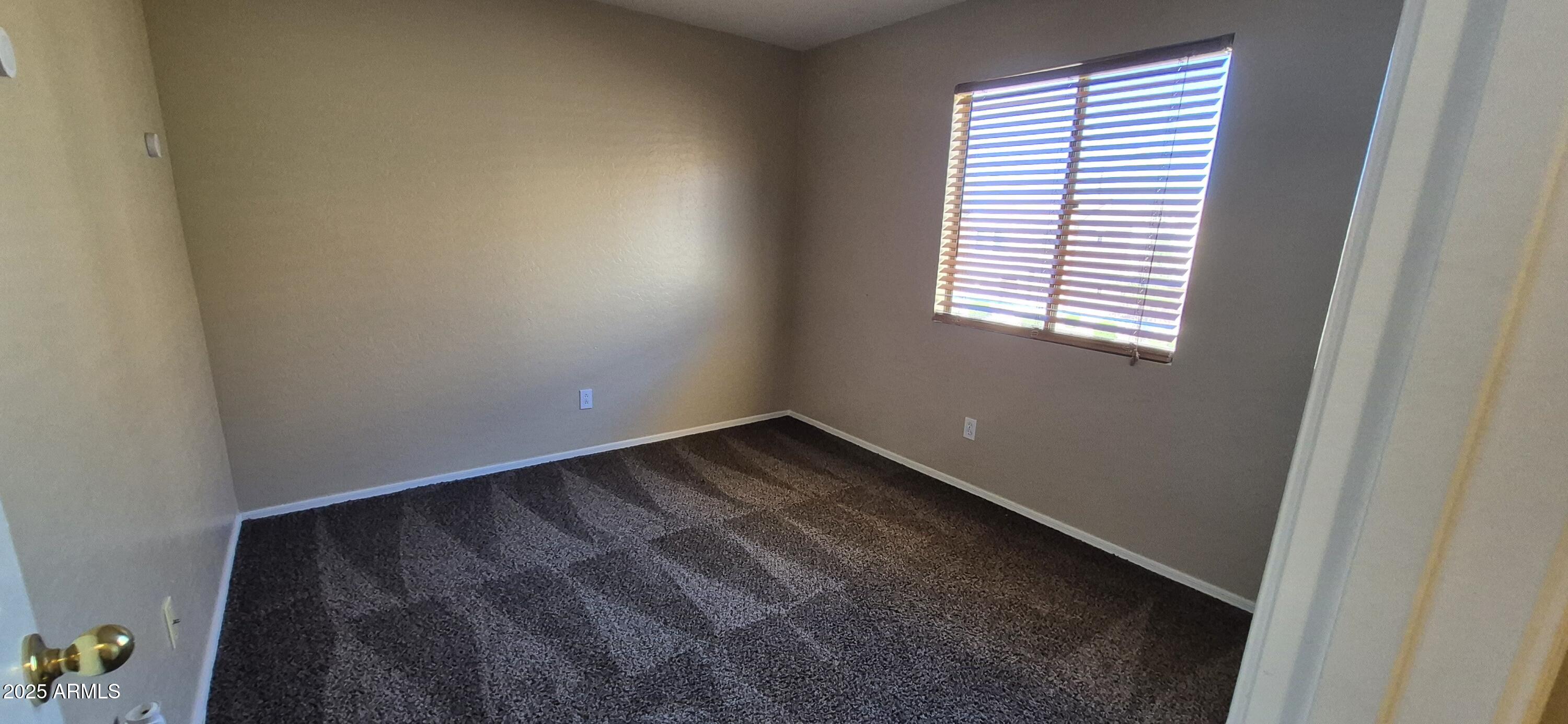 1347 East Dunbar Drive Phoenix, AZ 85042 - Photo 12 of 19 an empty room with a window