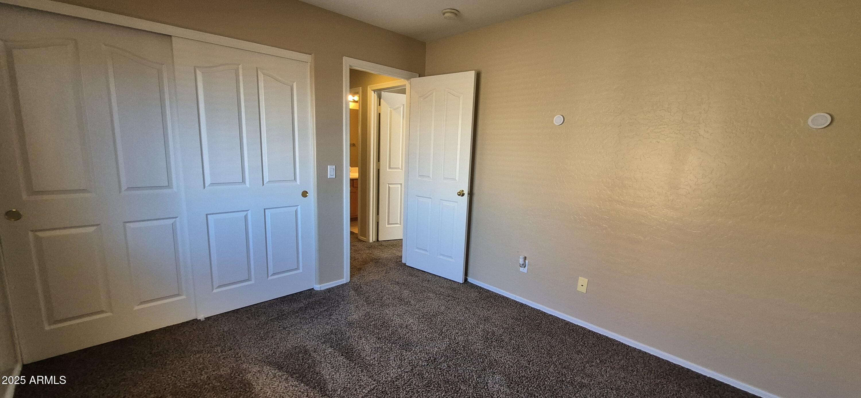 1347 East Dunbar Drive Phoenix, AZ 85042 - Photo 13 of 19 an empty room with closet area