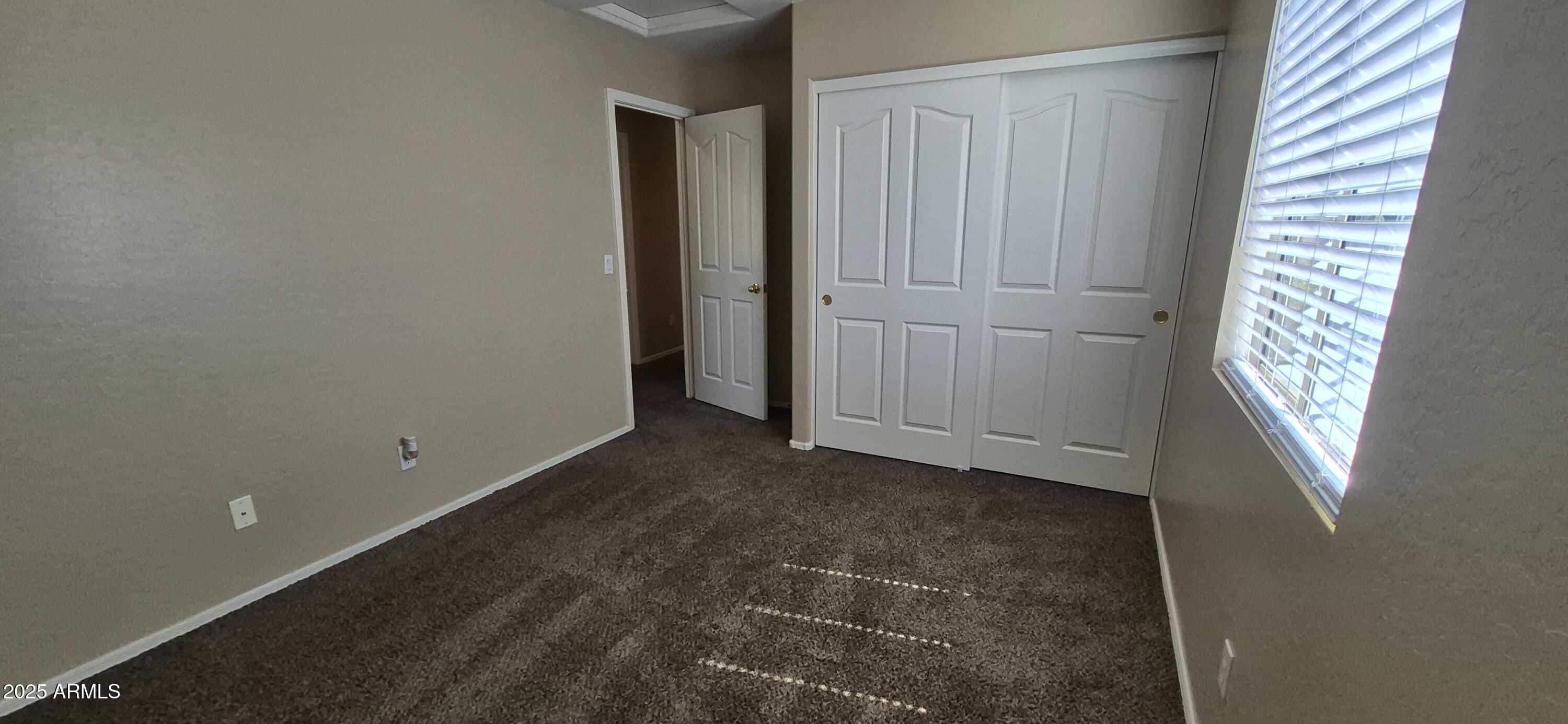 1347 East Dunbar Drive Phoenix, AZ 85042 - Photo 15 of 19 an empty room with windows