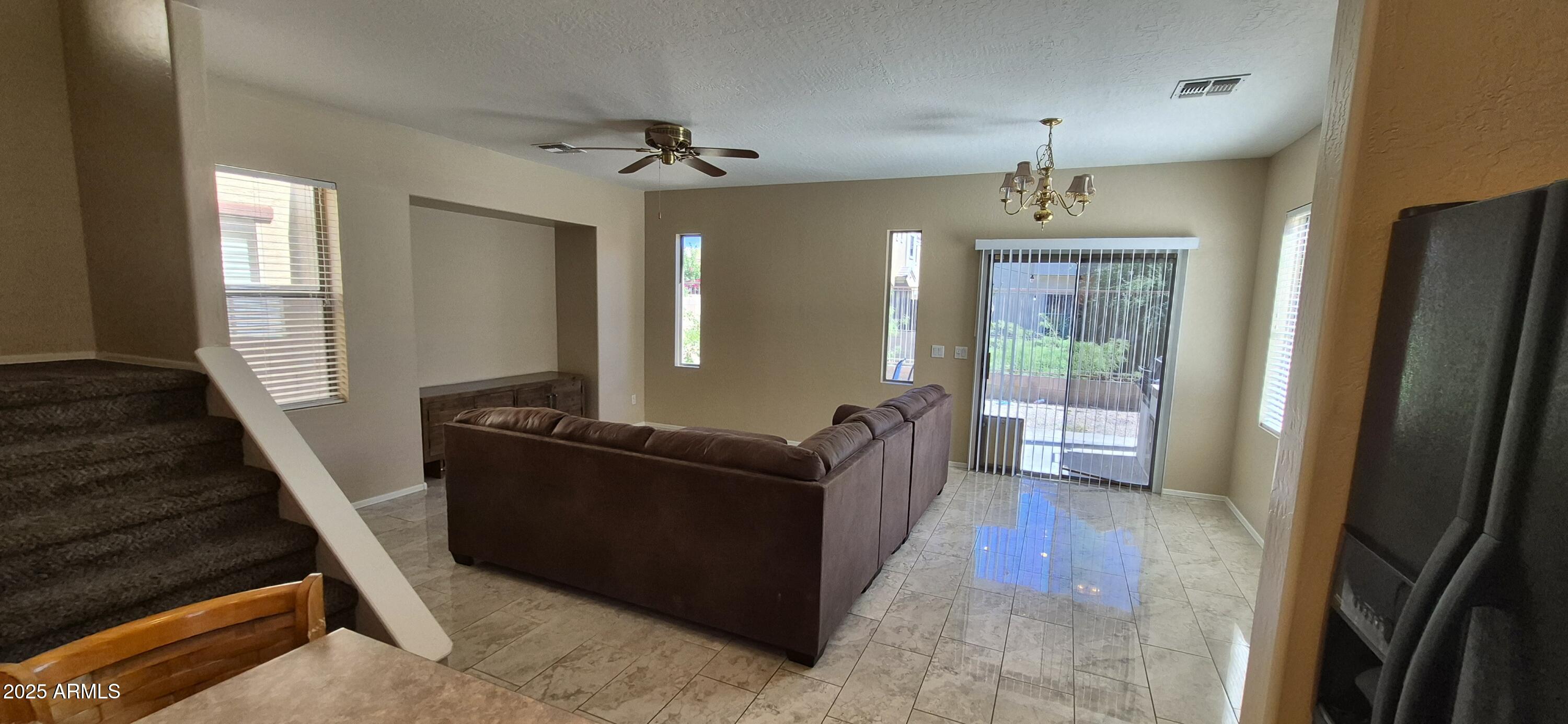 1347 East Dunbar Drive Phoenix, AZ 85042 - Photo 16 of 19 a living room with furniture and a fireplace