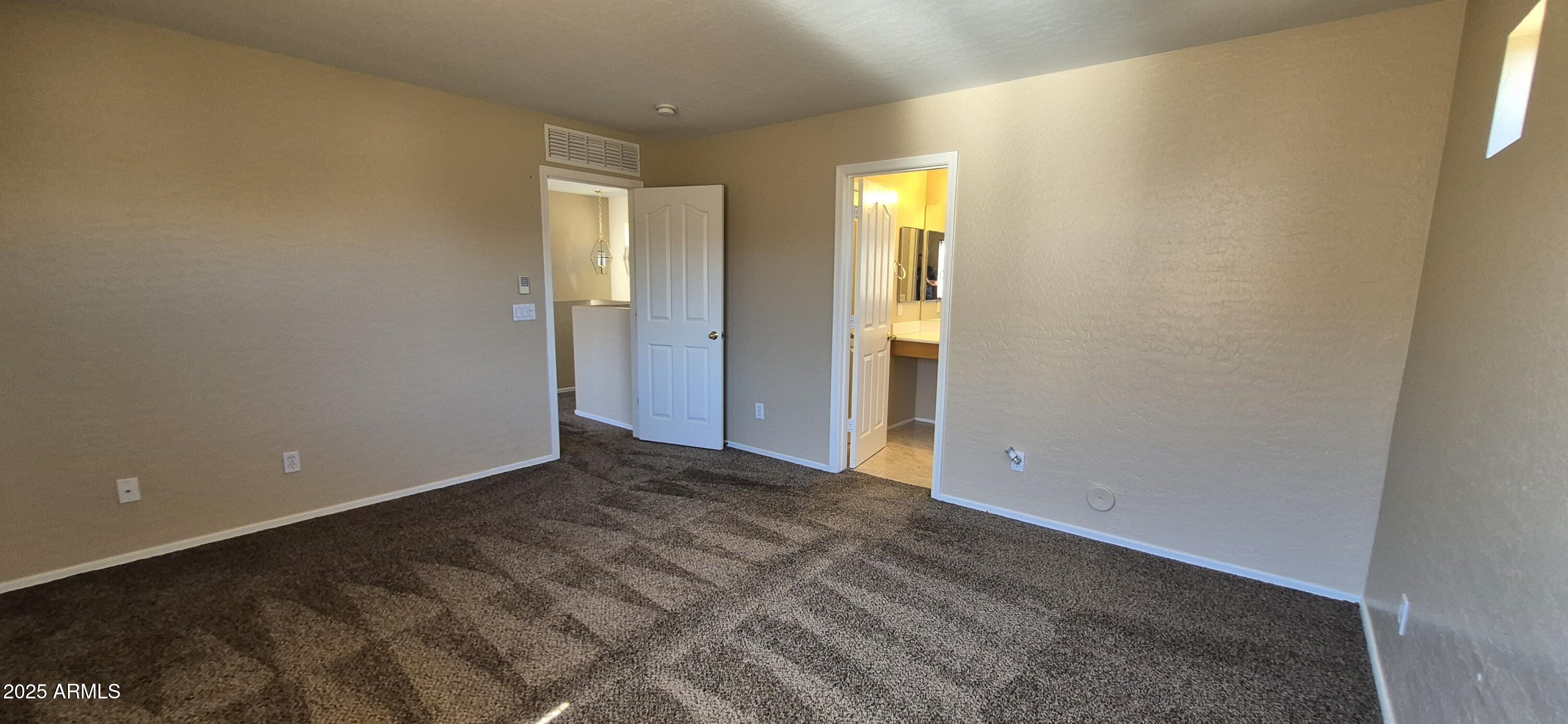 1347 East Dunbar Drive Phoenix, AZ 85042 - Photo 6 of 19 a view of an empty room with a window