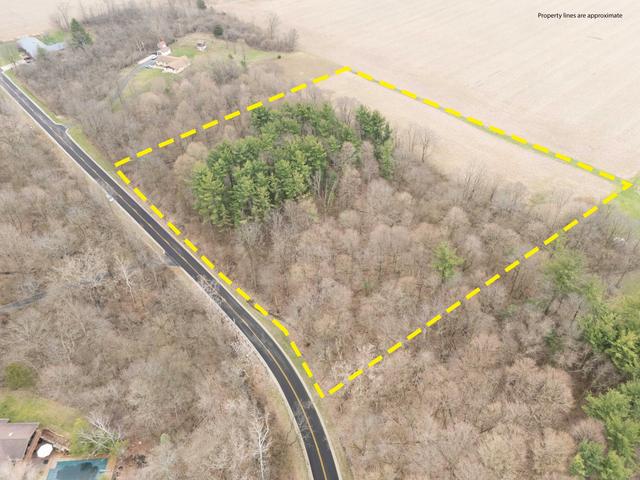 --- Childrens Home Road Sidney, OH 45365 - Photo 5 of 10 This expansive lot offers a blend of wooded serenity and open land, ideal for your vision.
