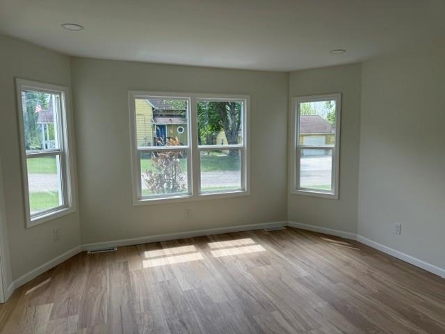 314 South High Street Granville, IL 61326 - Photo 11 of 22 an empty room with wooden floor and windows