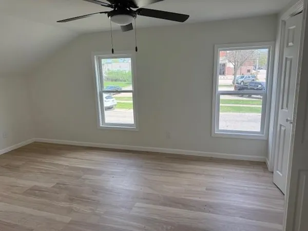 a view of an empty room with a window
