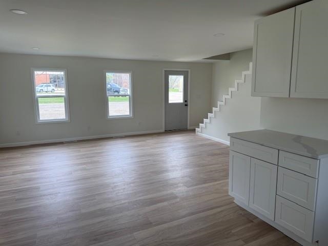 314 South High Street Granville, IL 61326 - Photo 7 of 22 an empty room with wooden floor and windows