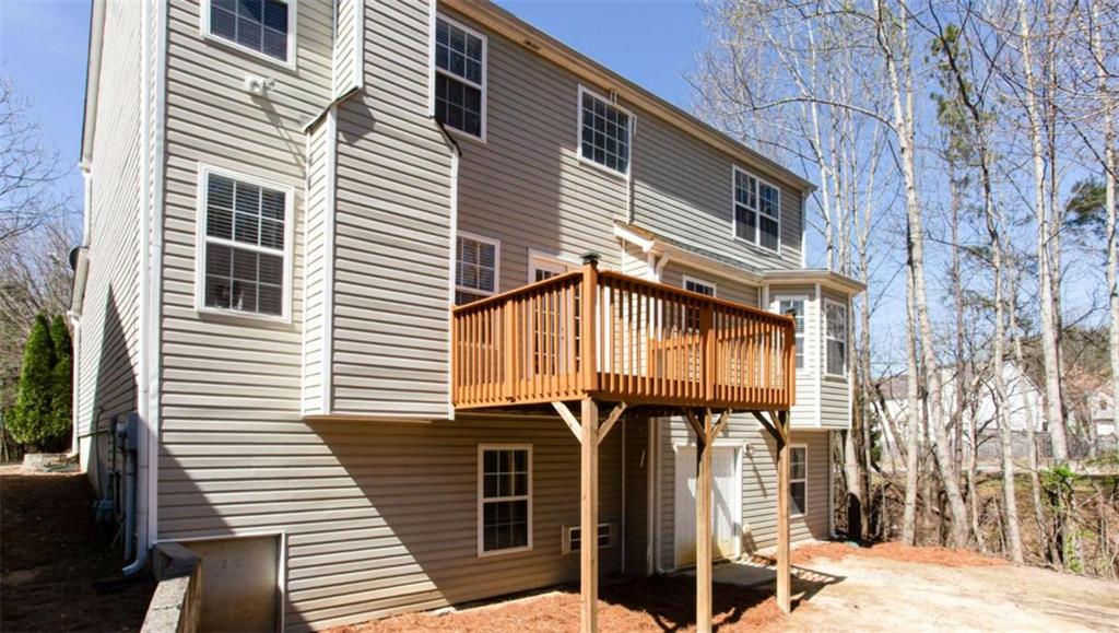 3721 Bogan Mill Road Northeast Buford, GA 30519 - Photo 56 of 58 a front view of a house with a street
