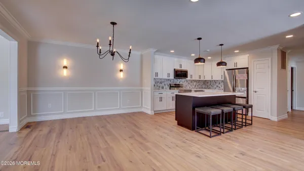 a view of kitchen with cabinets and wooden floor
