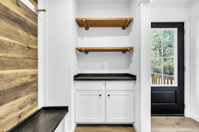 a view of walk in closet with living room
