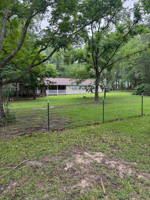 9004 Farm To Market 62 Corrigan, TX 75939 - Photo 3 of 27 a view of a house with a backyard