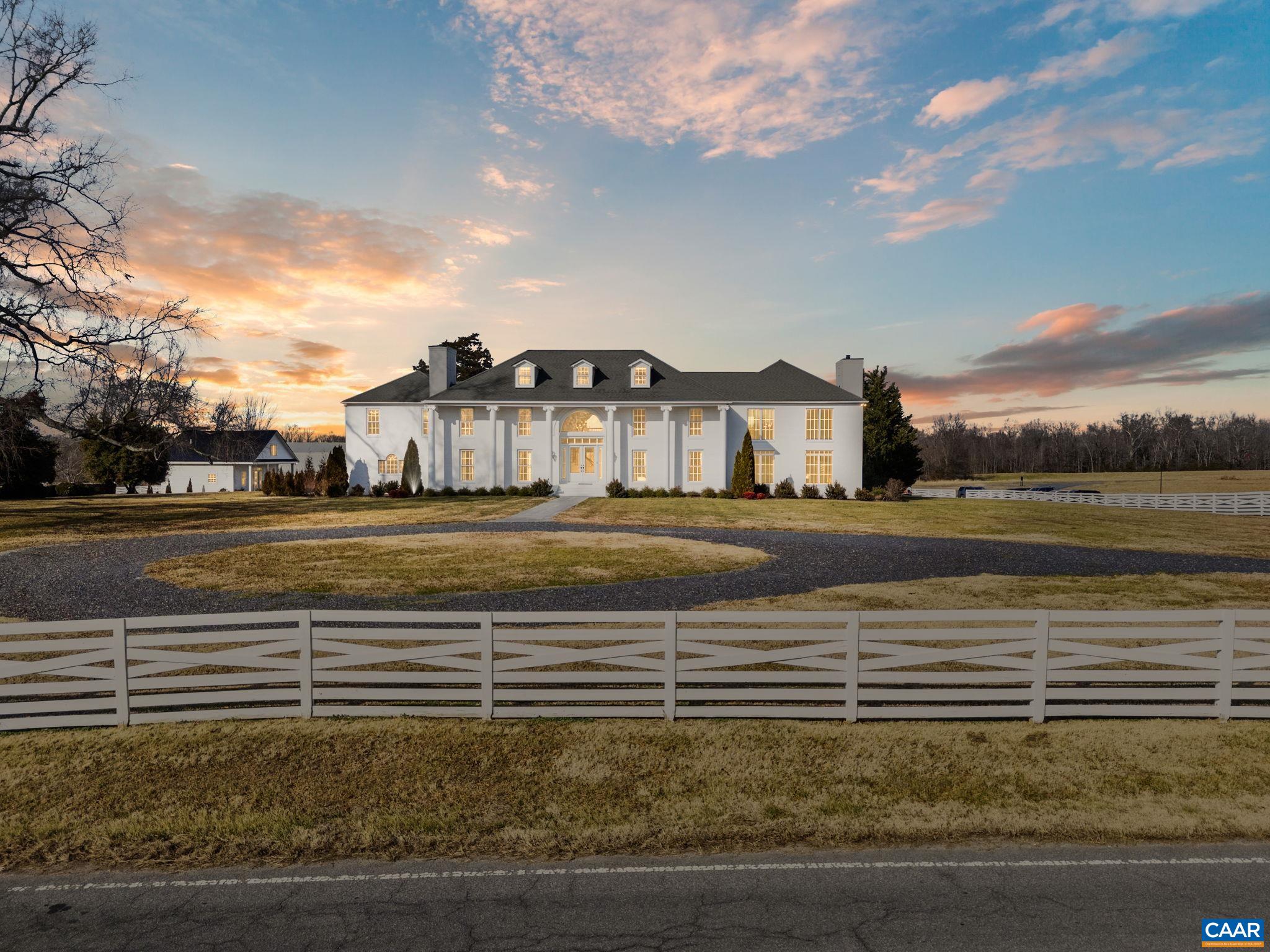 a view of a swimming pool with an outdoor space and seating area