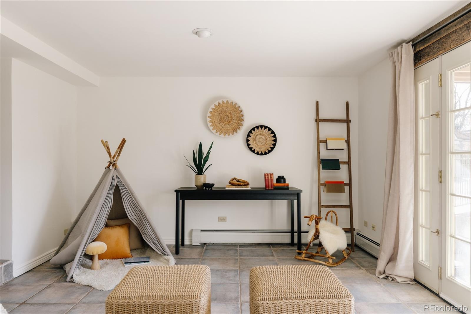 4035 Cody Street Wheat Ridge, CO 80033 - Photo 14 of 47 a living room with furniture and a window