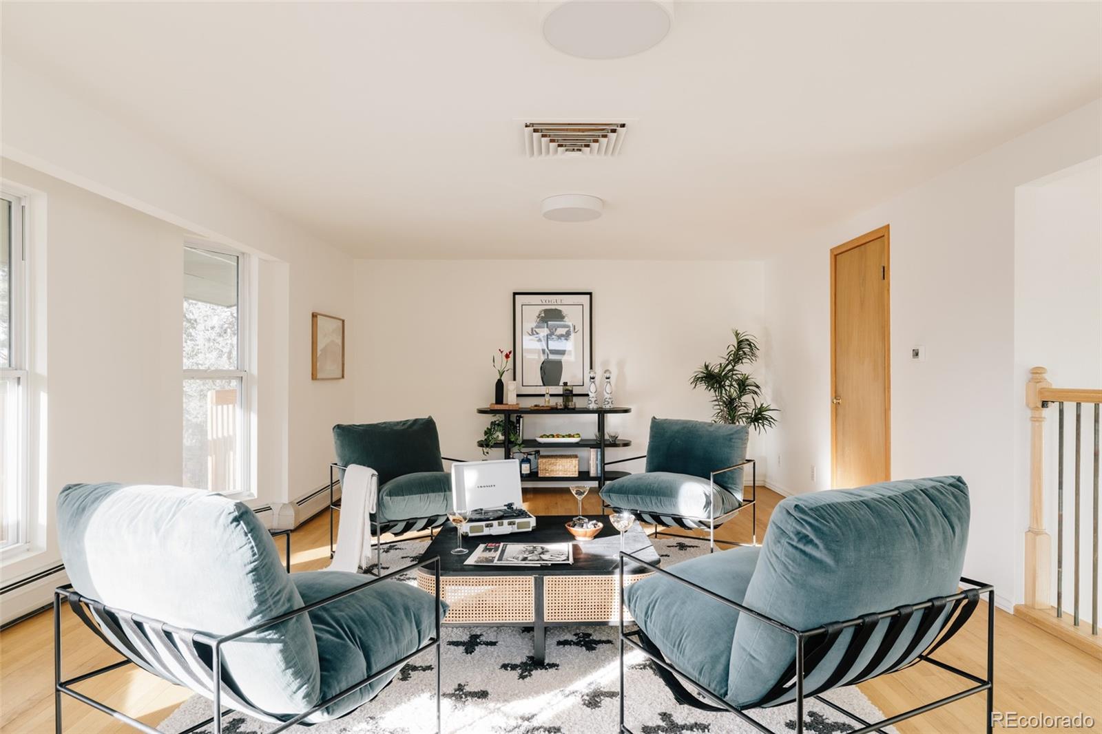 4035 Cody Street Wheat Ridge, CO 80033 - Photo 17 of 47 a living room with furniture and a window