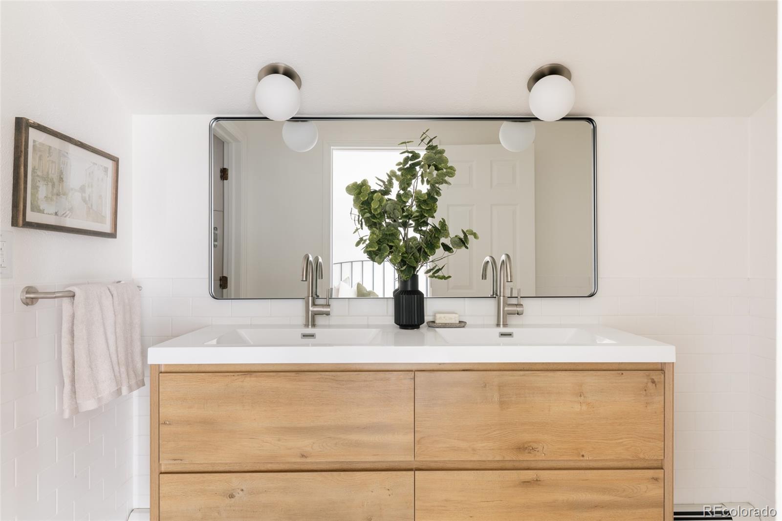 4035 Cody Street Wheat Ridge, CO 80033 - Photo 28 of 47 a bathroom with a sink and a mirror
