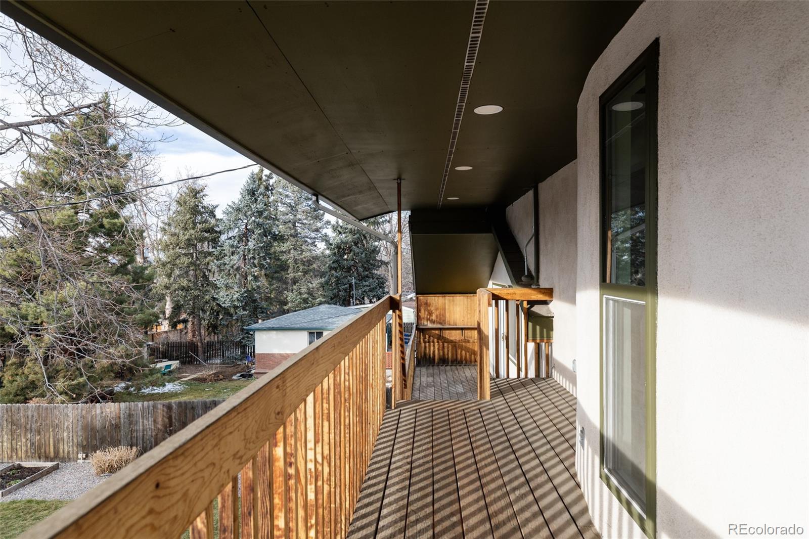 4035 Cody Street Wheat Ridge, CO 80033 - Photo 37 of 47 a balcony view with two chairs and a table