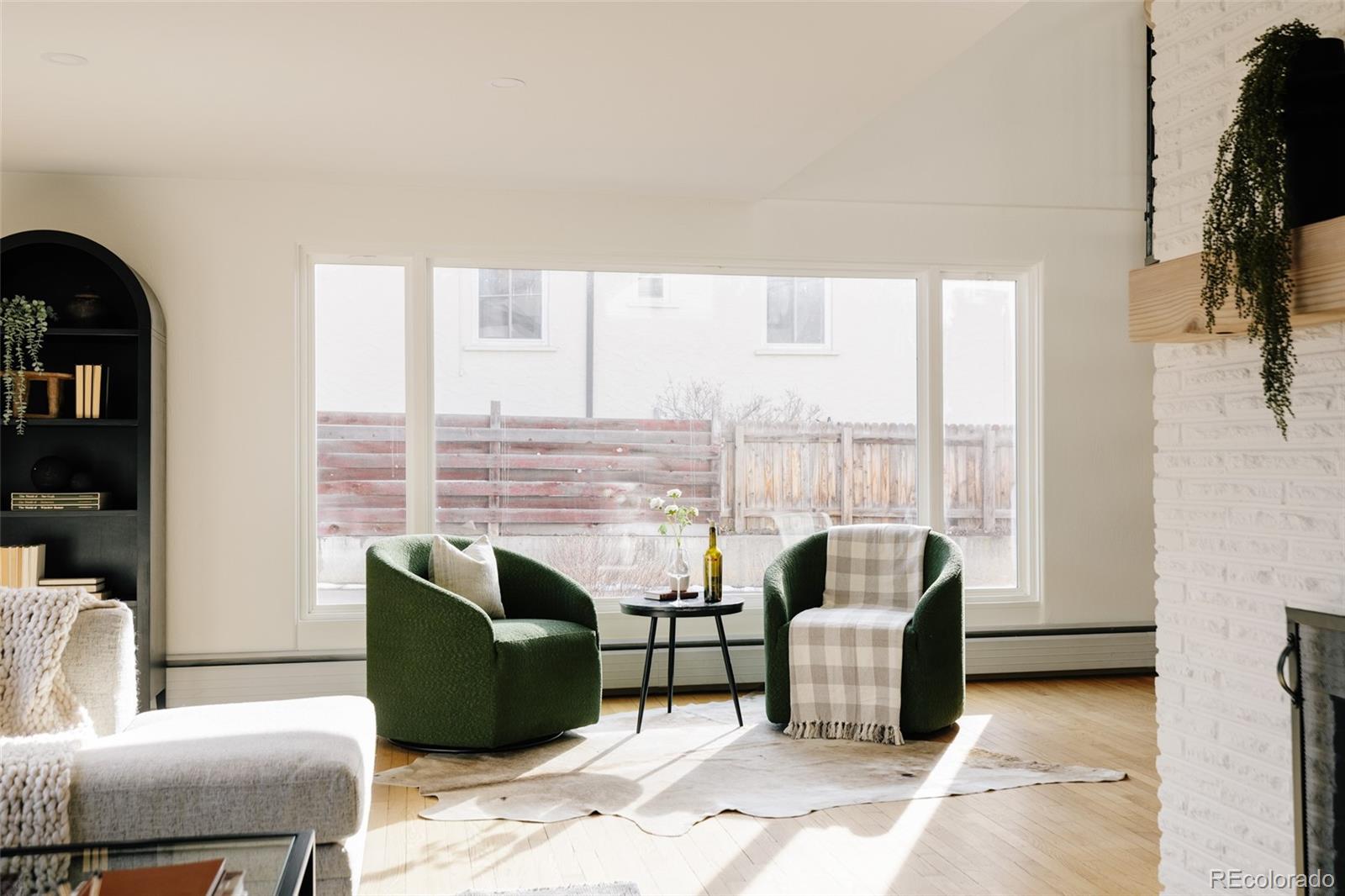 4035 Cody Street Wheat Ridge, CO 80033 - Photo 4 of 47 a living room with furniture and large windows