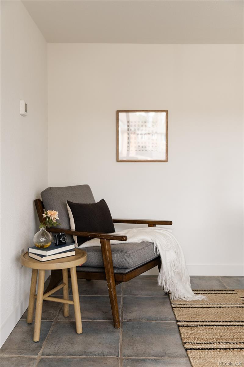 4035 Cody Street Wheat Ridge, CO 80033 - Photo 46 of 47 a living room with a couch