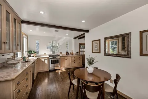 a large kitchen with a table and chairs
