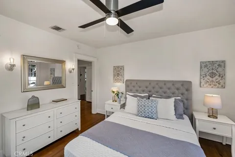 a bedroom with a bed and a dresser