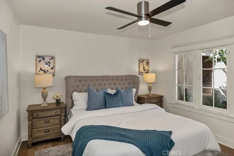 a bedroom with a bed and window