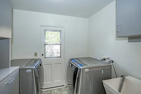 a view of a livingroom with wooden floor and entryway
