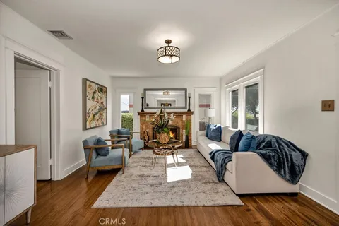 a living room with furniture rug and window